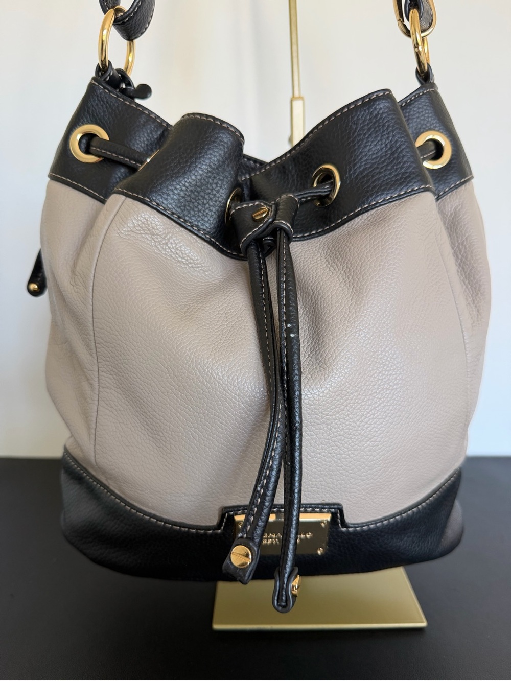 Tignanello Two Tone Taupe Black Leather Drawstring Bucket Shoulder Bag